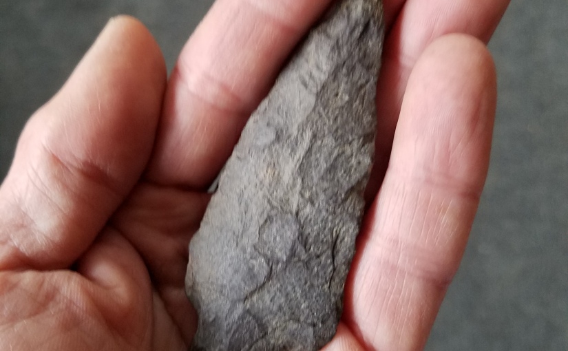 Stone arrow head pointing to our past
